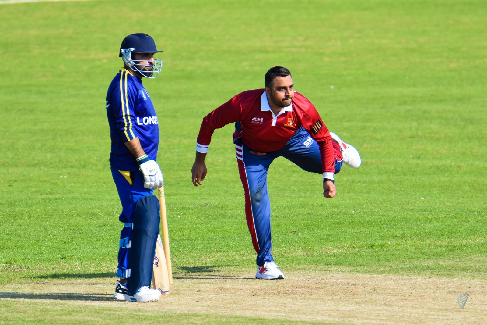 Aman bowling during a cricket match
