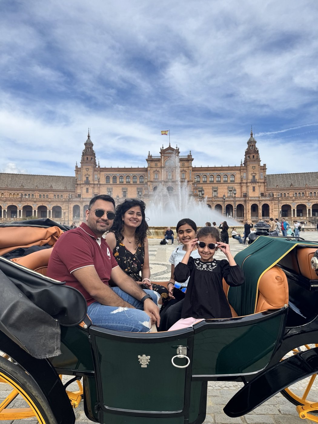 Aman and his family on a horse-drawn carriage in Seville